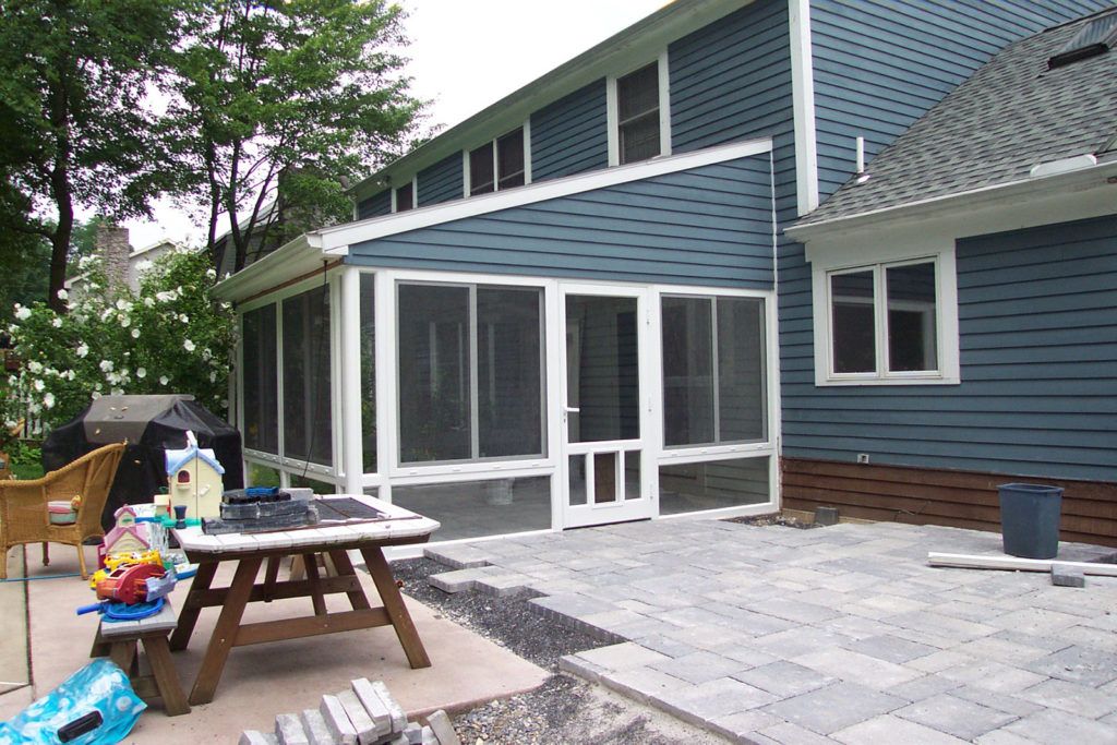 Elite 2000 sunroom glass enclosure on a residential home