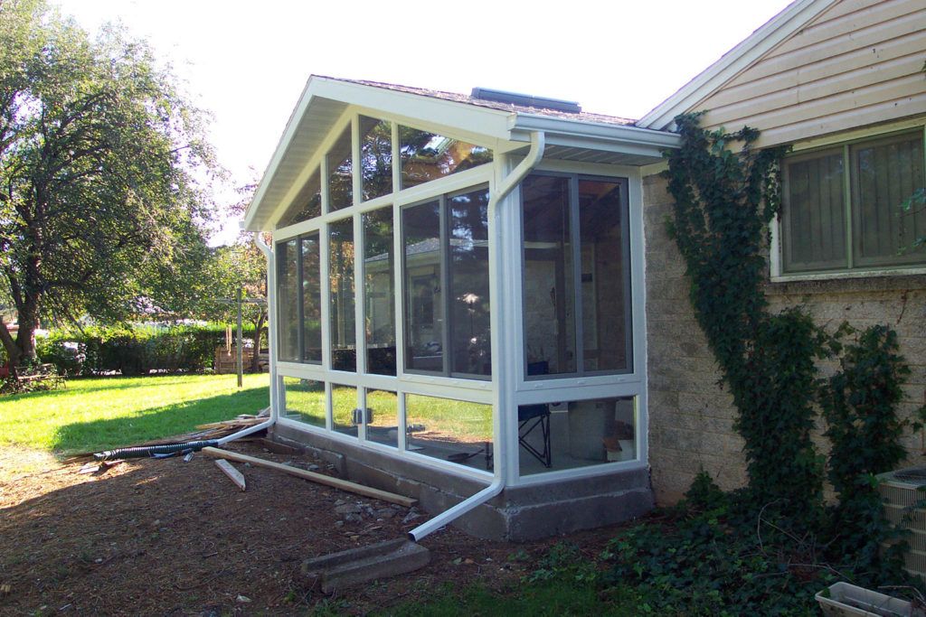 Elite 2000 sunroom glass enclosure on a residential home
