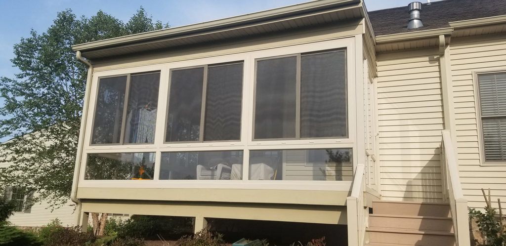 Elite 2000 sunroom glass enclosure on a residential home