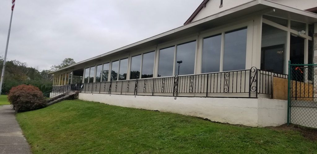 Elite 2000 sunroom glass enclosure on a residential home