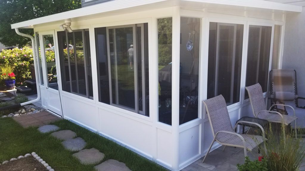 Elite 2000 sunroom glass enclosure on a residential home