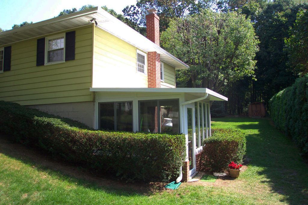 Elite 2000 sunroom glass enclosure on a residential home
