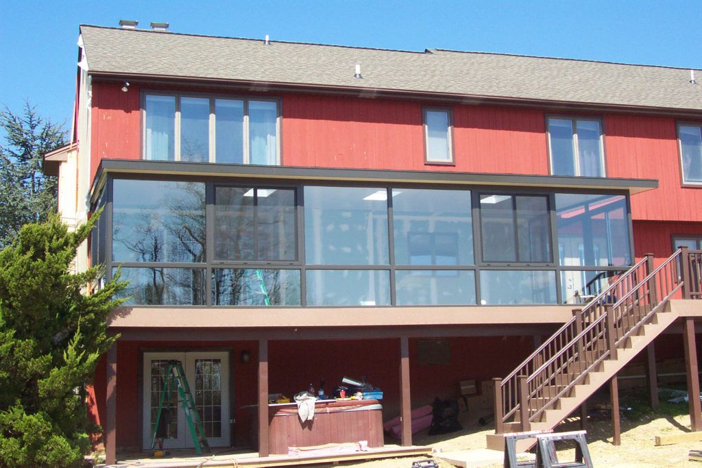 Elite 2000 sunroom glass enclosure on a residential home