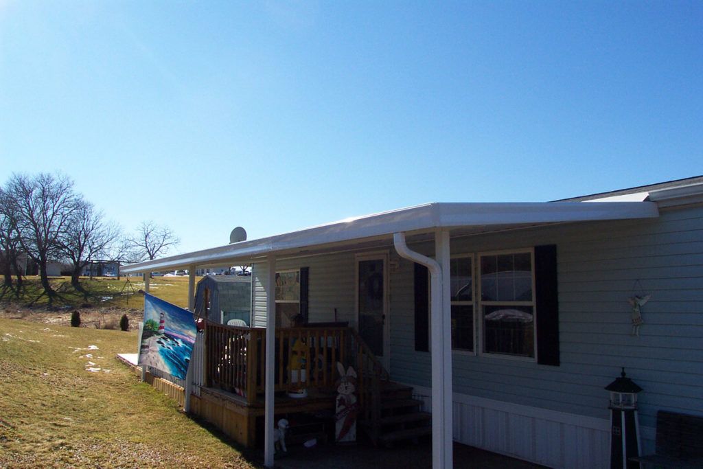 Flat pan single skin patio cover roof system on a residential home
