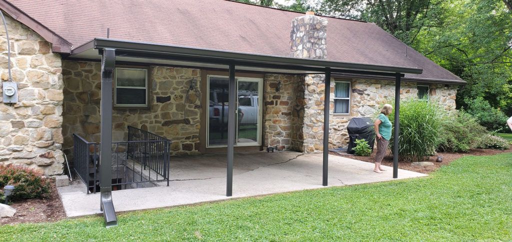 Flat pan single skin patio cover roof system on a residential home