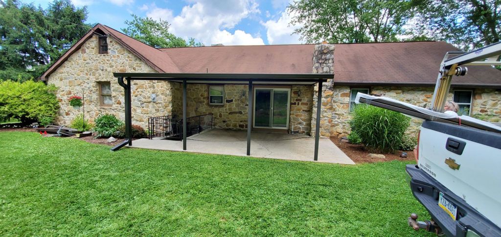 Flat pan single skin patio cover roof system on a residential home