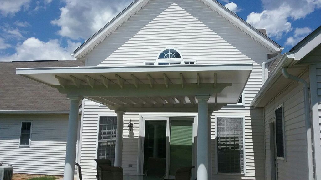 Flat pan single skin patio cover roof system on a residential home