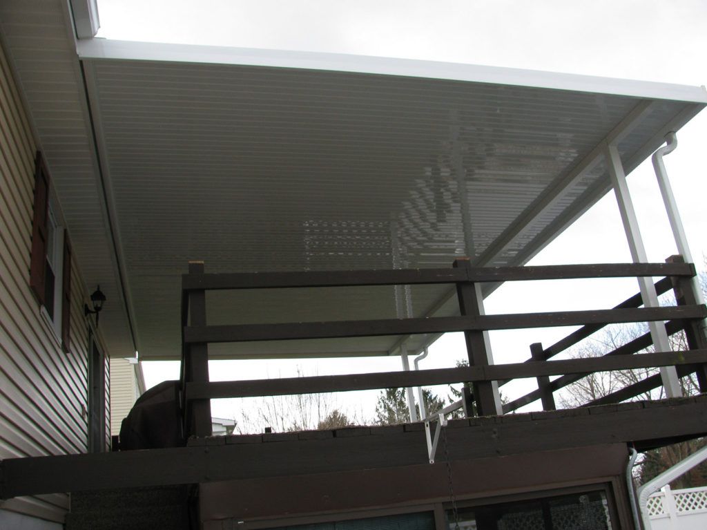 Flat pan single skin patio cover roof system on a residential home