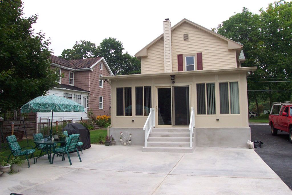 NatureScape Sunroom glass enclosure on a residential home