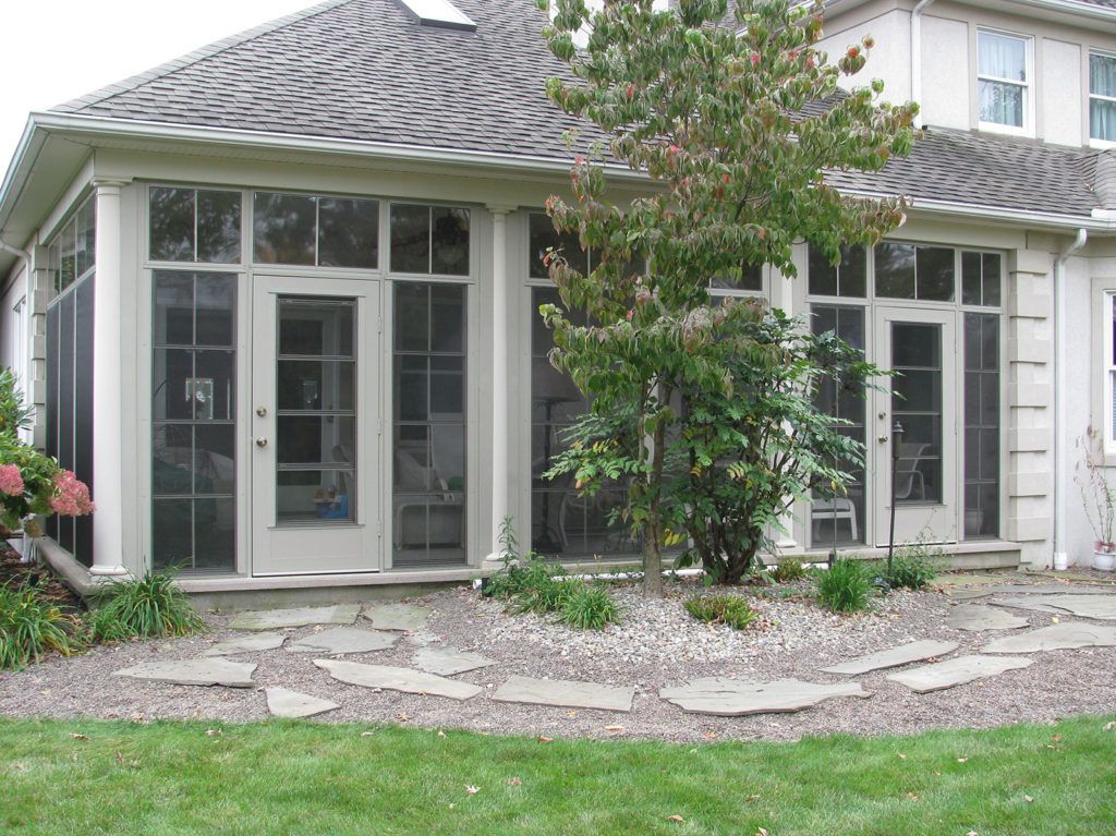 NatureScape Sunroom glass enclosure on a residential home