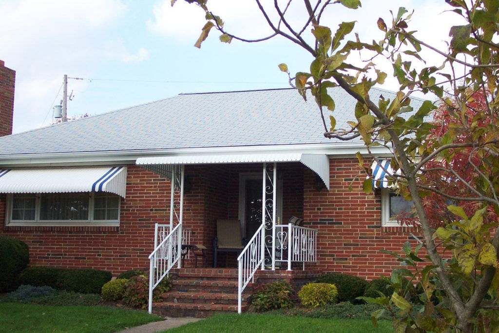 Aluminum Fairlite door hood awning on a residential home