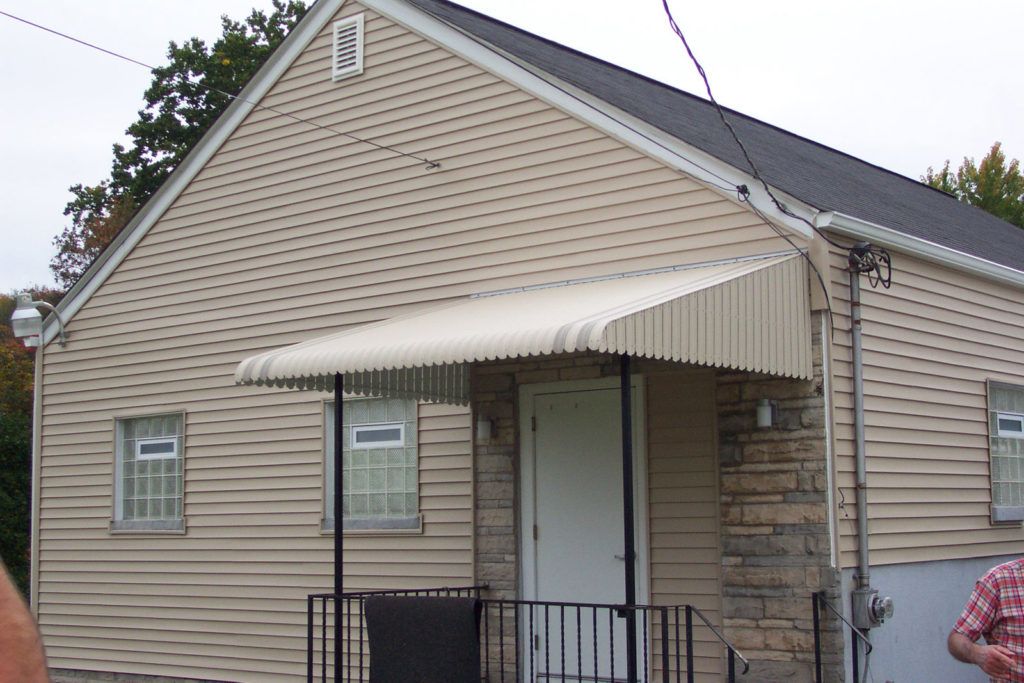 Aluminum Fairlite door hood awning on a residential home
