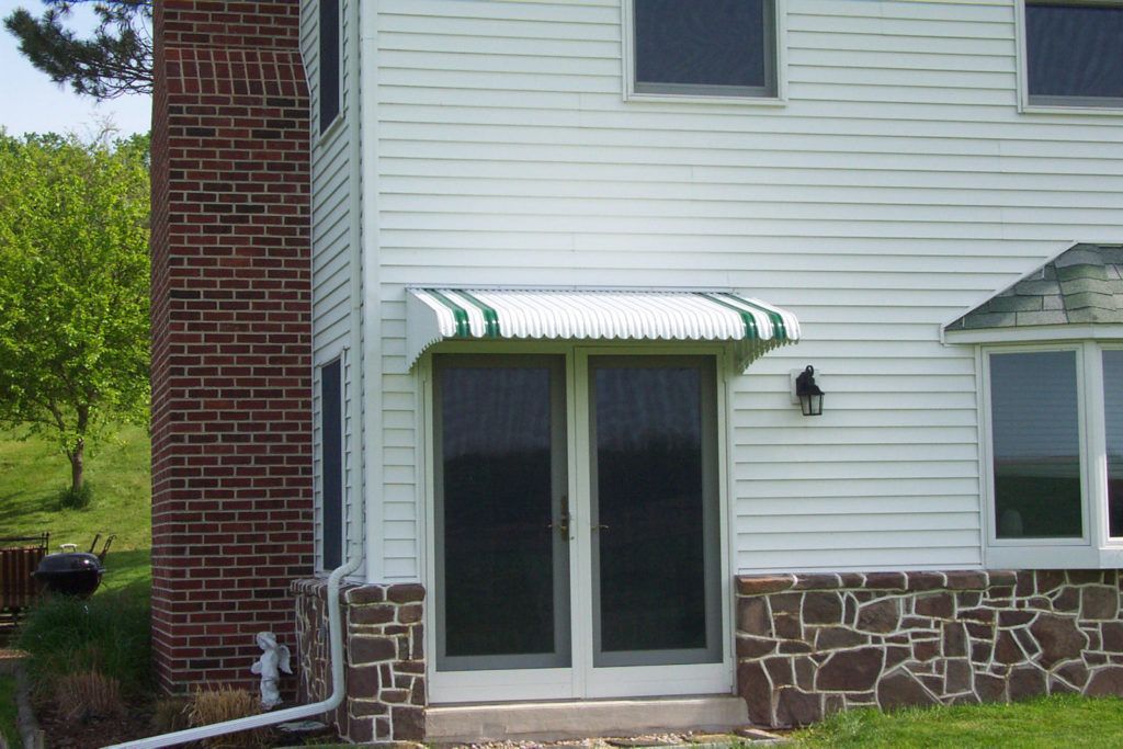 Aluminum Fairlite door hood awning on a residential home